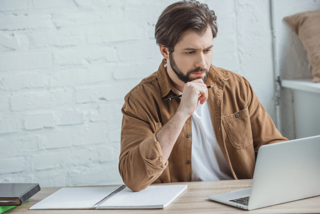 Businessman using laptop at workspace