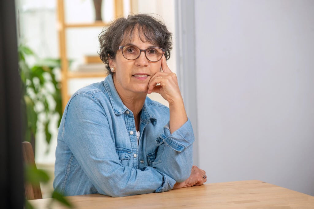 Portrait of senior brunette with a jeans jacket