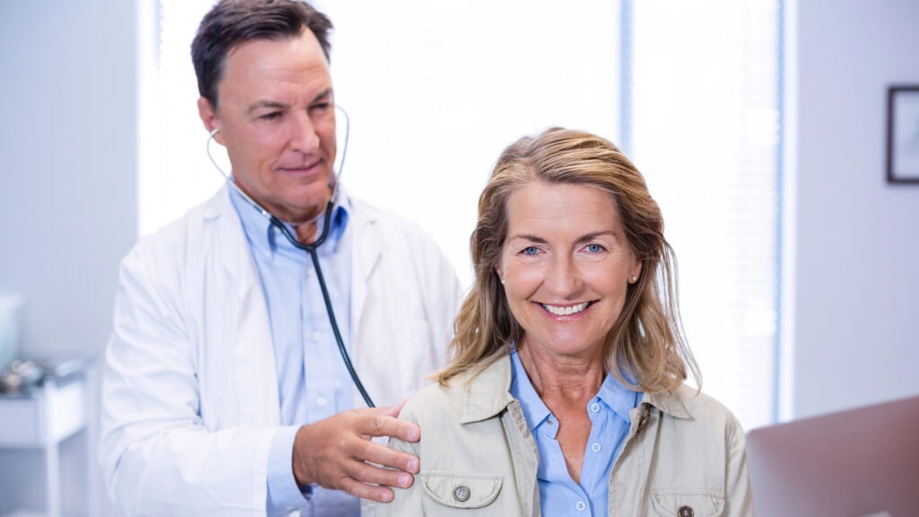 Doctor examining a senior woman