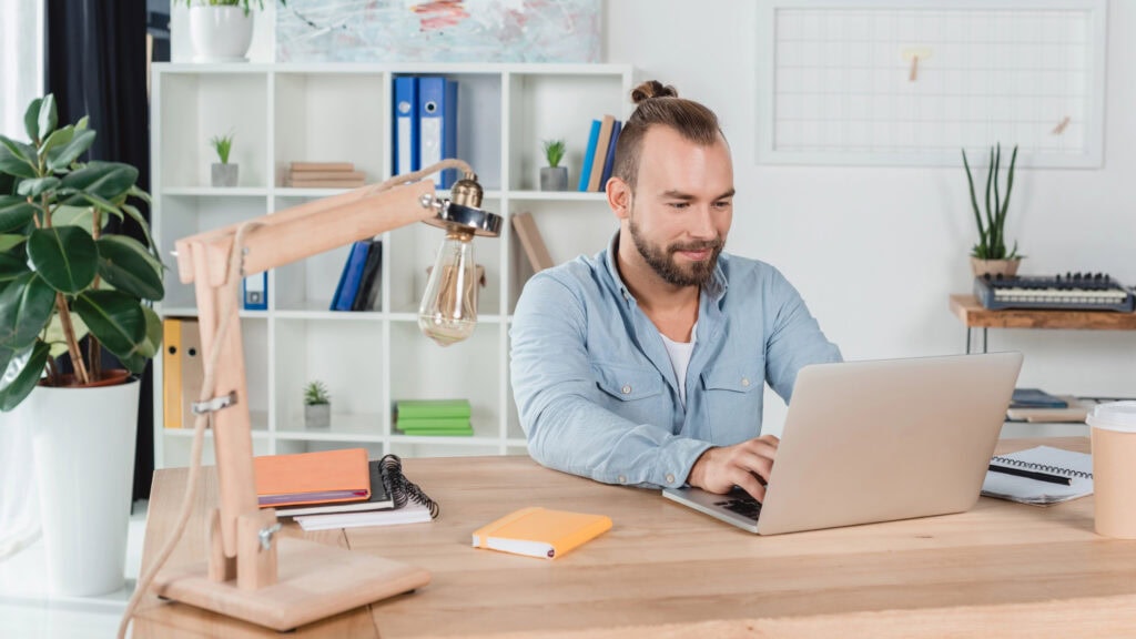 Young man working with laptop