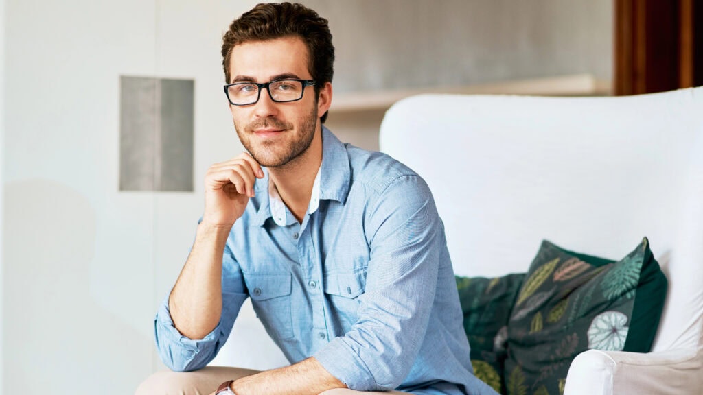 Enjoying some personal time. Portrait of a handsome young man relaxing at home.