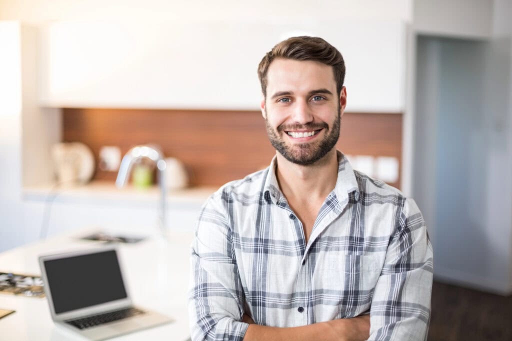 Man by kitchen counter
