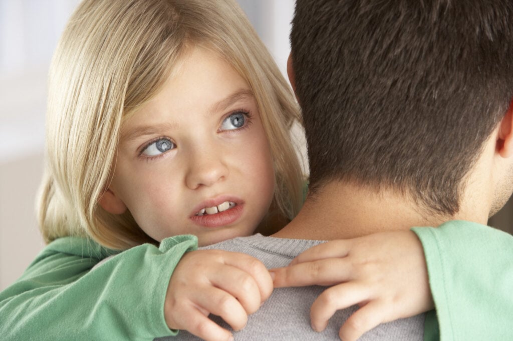 Portrait Of Happy Daughter Looking Over Fathers Shoulder