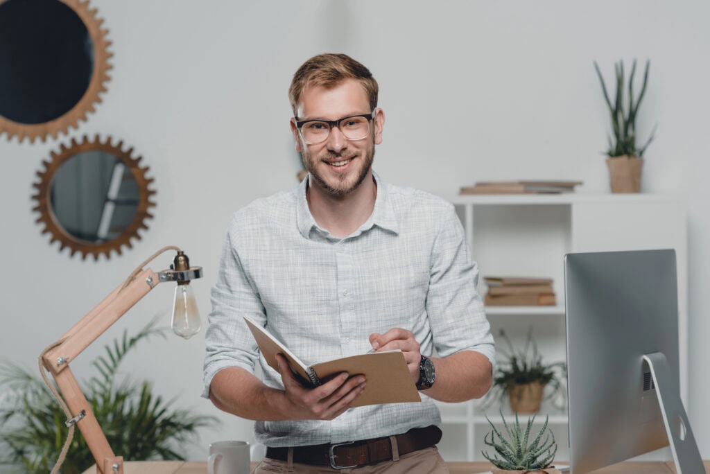 Businessman writing in diary
