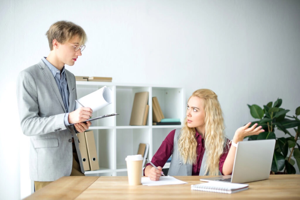 Woman talking with colleague