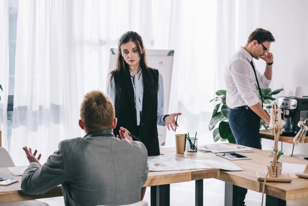 Group of young businesspeople working together at office