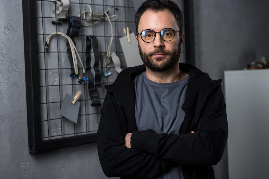Man with arms crossed looking at camera