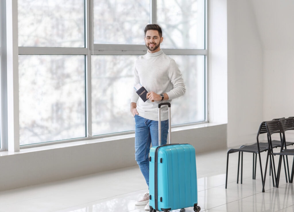 man waiting for his flight at the airport