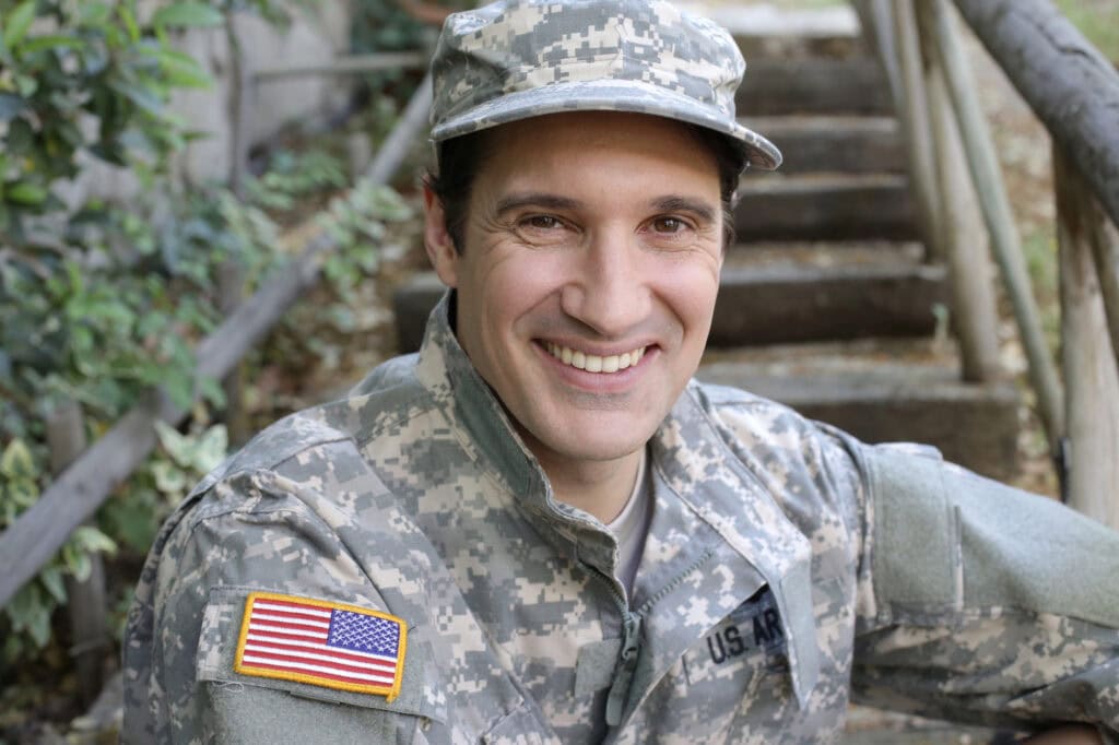 Young soldier in uniform outdoors