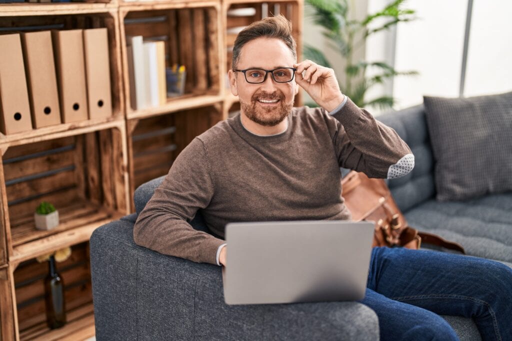 Young caucasian man business worker using laptop working at office