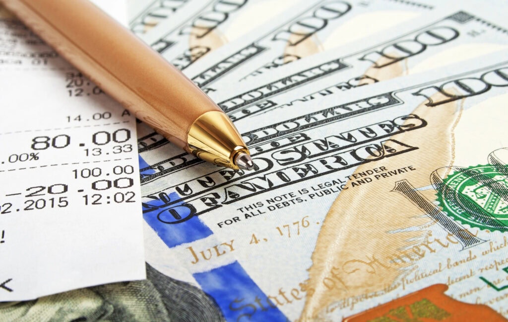Business concept - money, pen and cash voucher