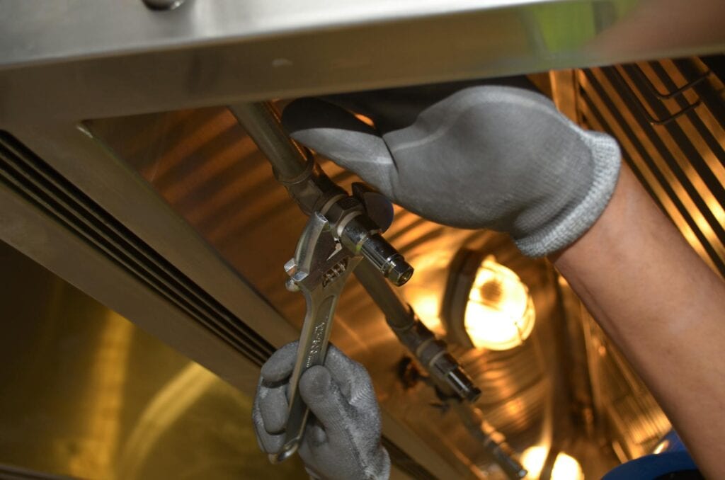 Plumber fixing tubes.