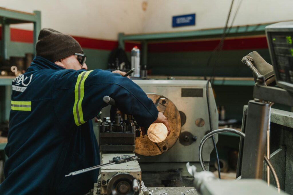 Industrial Worker Operating Heavy Machinery in Workshop