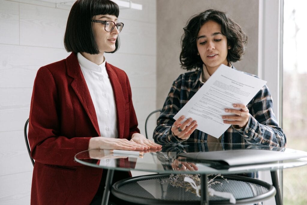 Two women discussing home insurance