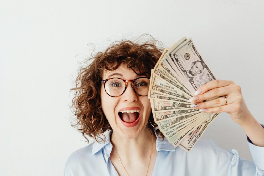 Woman holding dollars