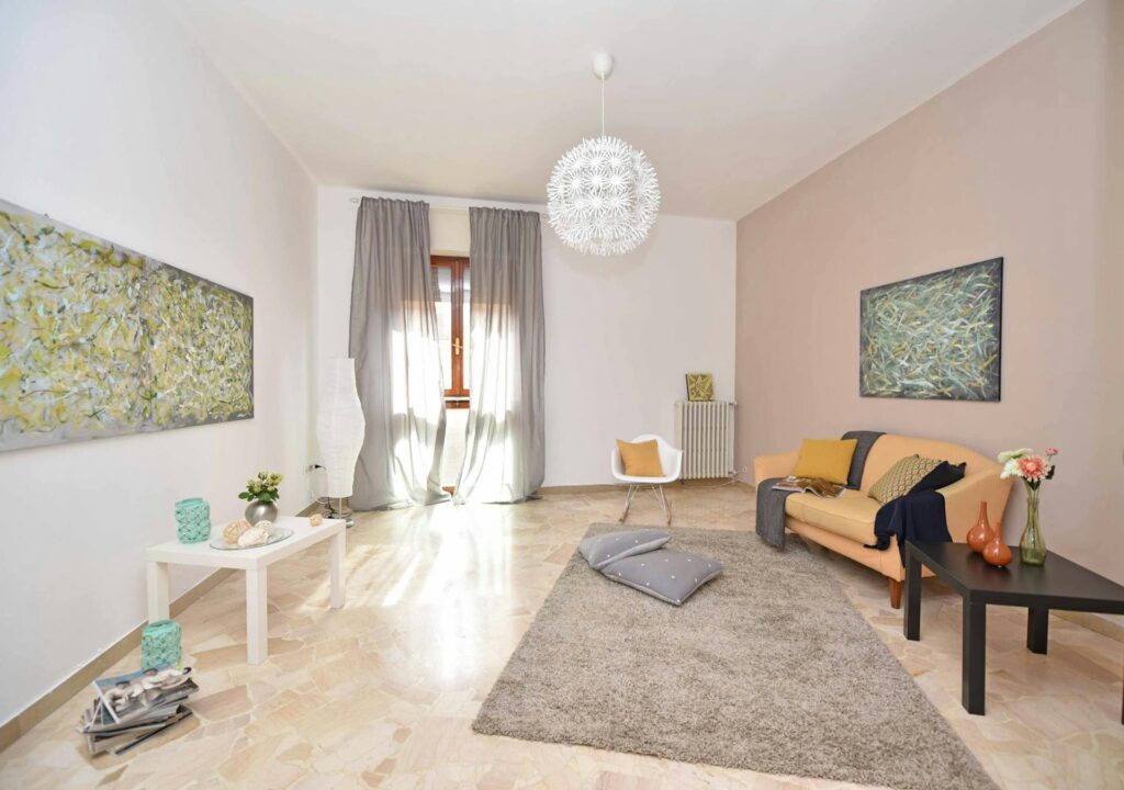 Room with sofa and painting.