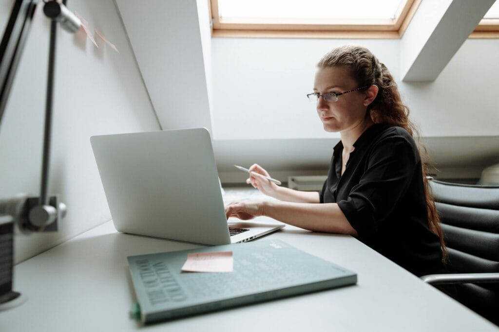 Close-up Photo of Female Architect using Laptop