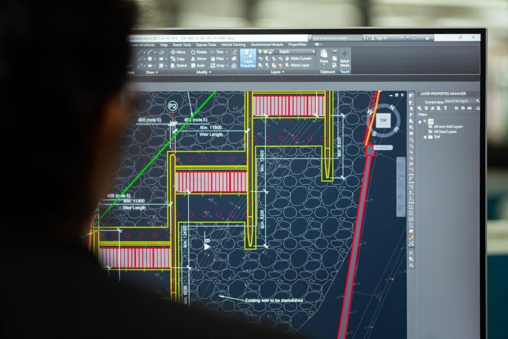 Technician checking monitor. 