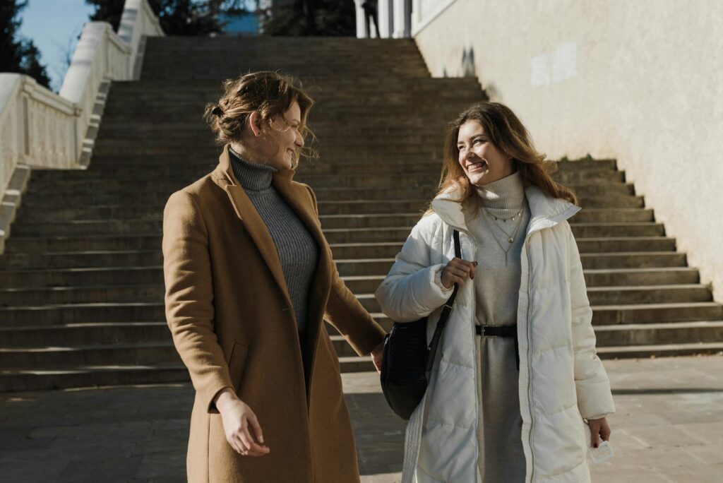 Happy Women Wearing Coats