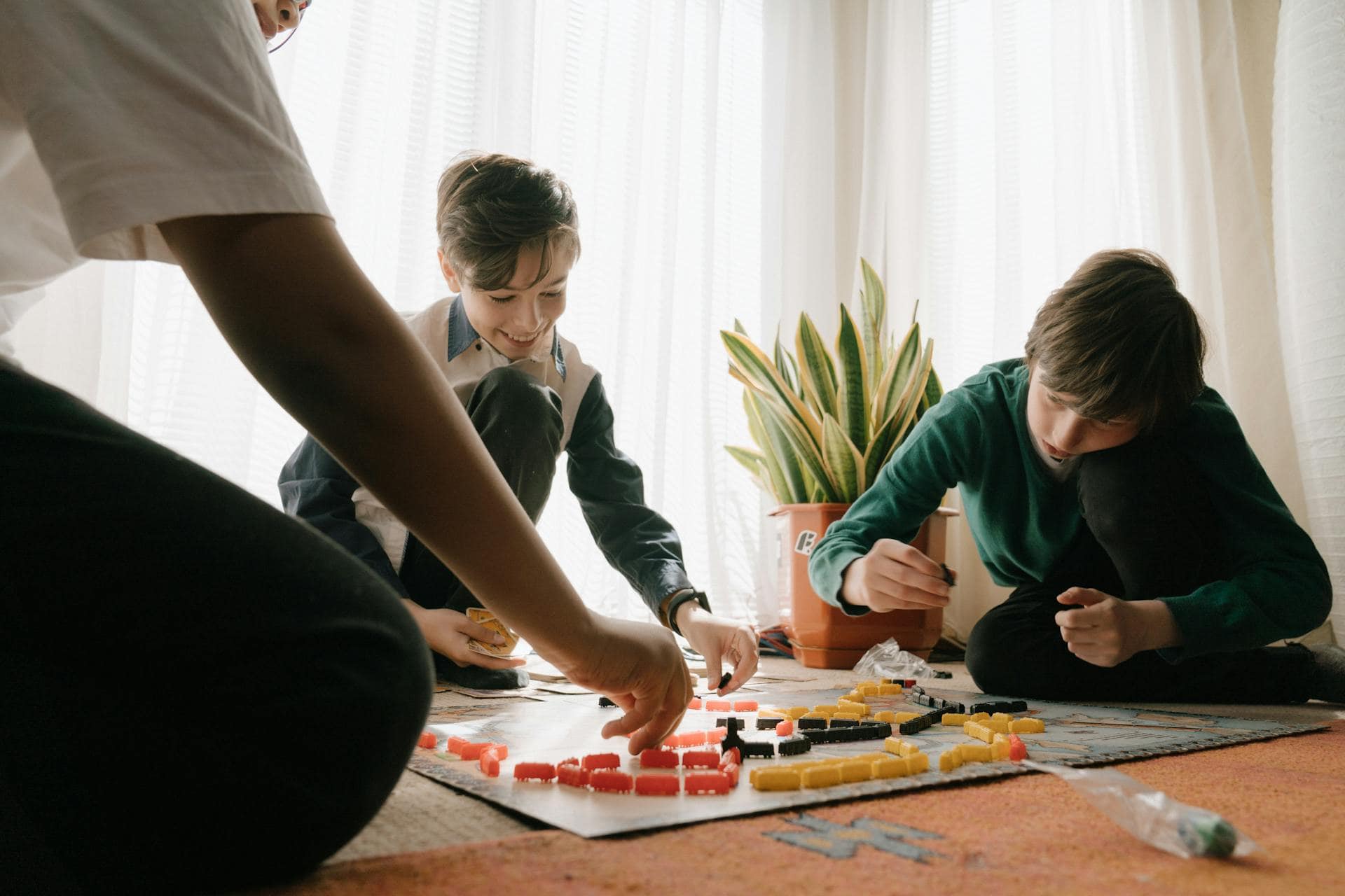 Man in Green Long Sleeve Shirt Playing Chess