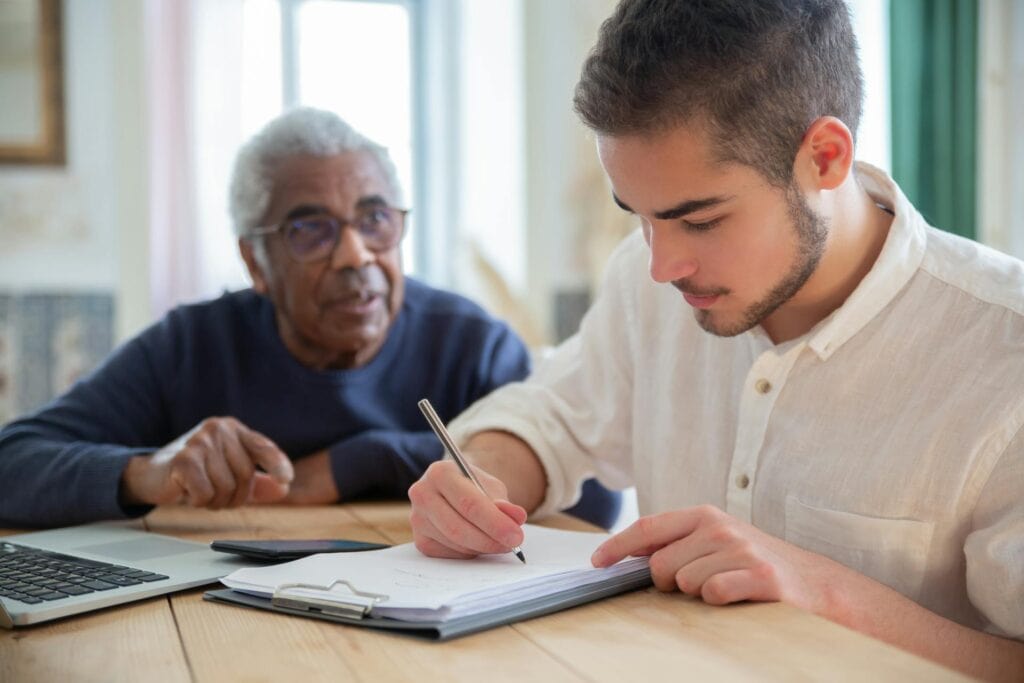 A Man Writing on White Paper