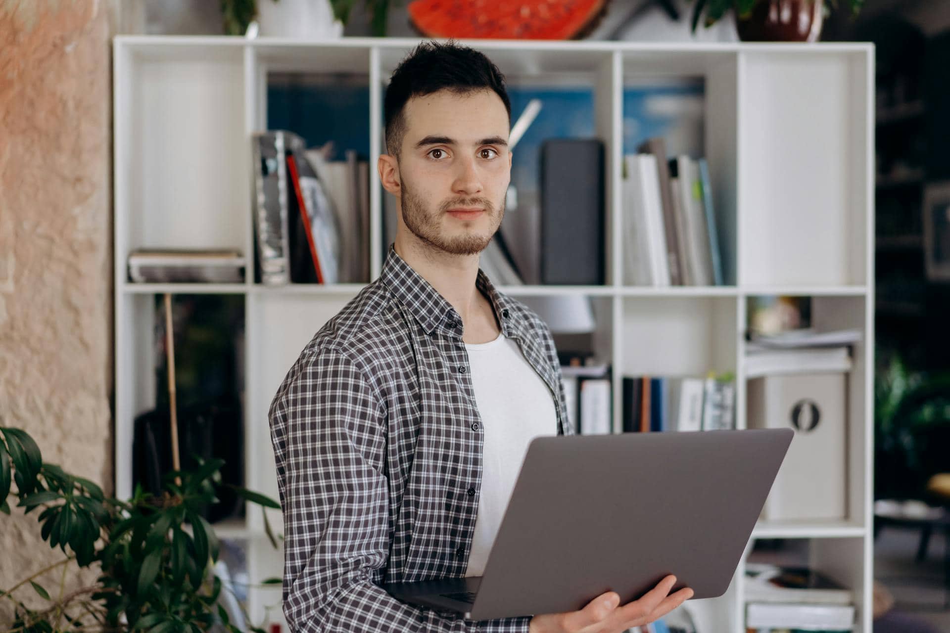 Construction Worker Operates Lift on Red Truck Outdoors