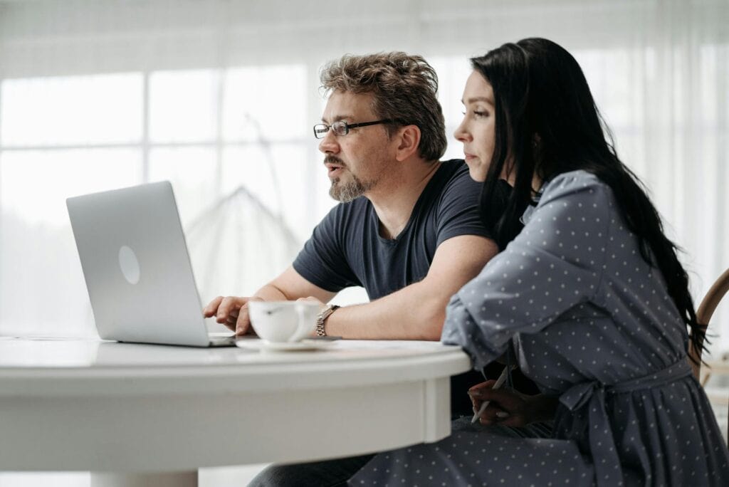 Couple Looking at a Laptop
