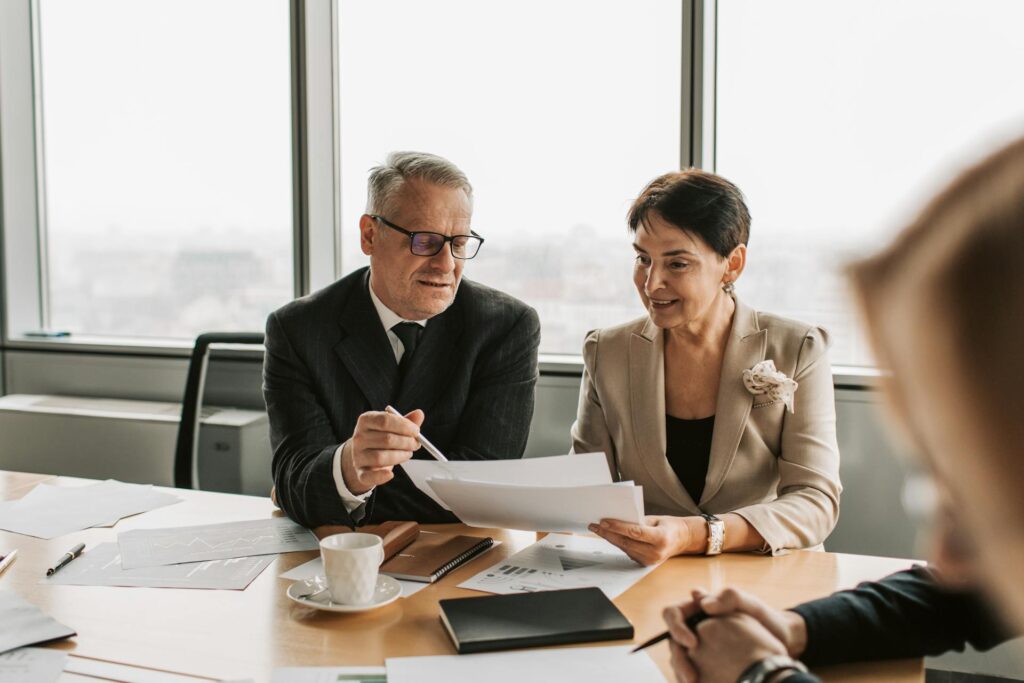A Man and a Woman Looking at Papers