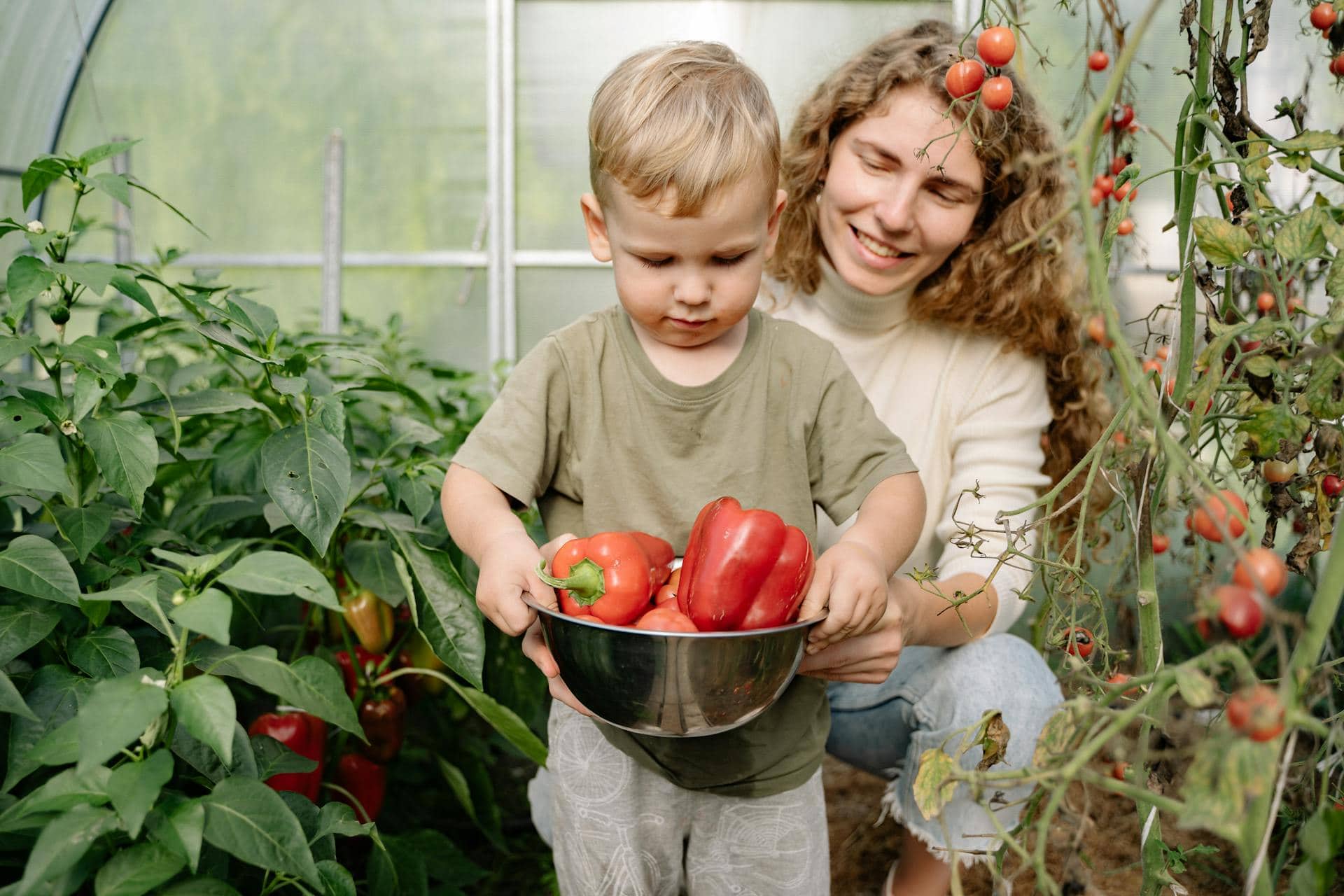 A Boy with his Mother in a Greenhouse